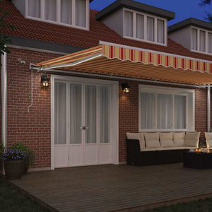 Utfällbar markis med LED -remsljus Gul och Orange 600 × 300 cm