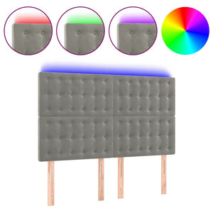 Sänggavel LED ljusgrå 144x5x118/128 cm sammet