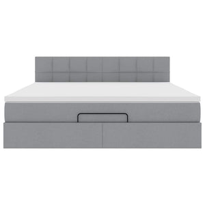 Ottomansk säng med madrass och LED-lampor ljusgrå 180x200cm tyg