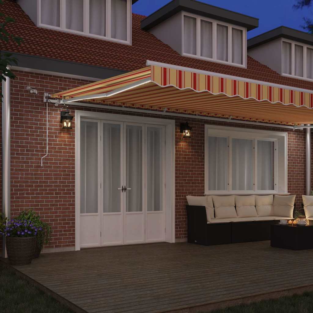 Utfällbar markis med LED -remsljus Gul och Orange 600 × 300 cm